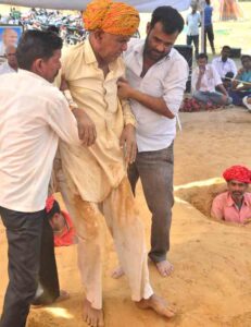 Farmer Graveyard Pits Neck-deep